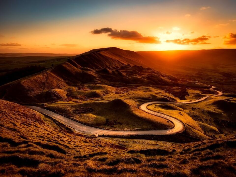 The Bumpy Road To Smart Systems Adoption | Mitigating Adoption Risk With Innovative Business Models | mountain road at sunset